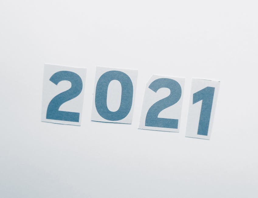 Simple paper cutout showing the year 2021 on a plain background.