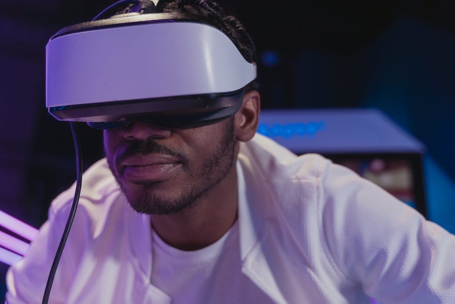 A man wearing VR glasses fully immersed in a virtual reality experience indoors.