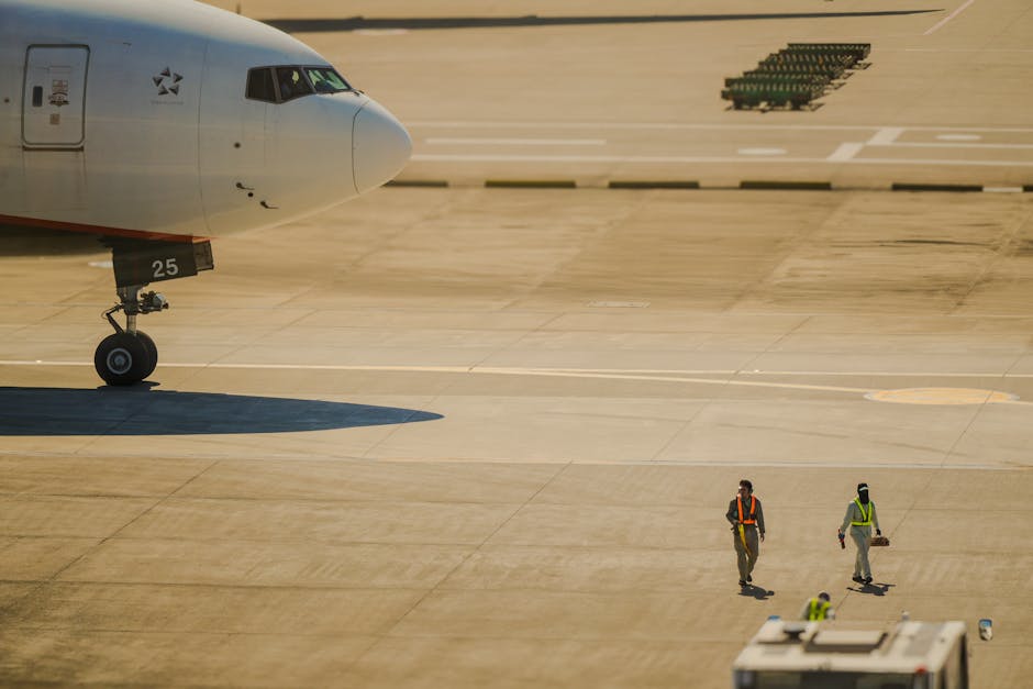 A crew walking on the tarmac near a plane at Taoyuan Airport, Taiwan.