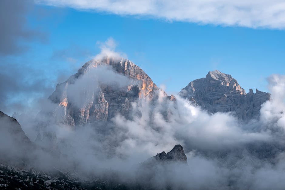 Breathtaking view of the Tofane peaks shrouded in clouds in the Dolomites, Cortina d'Ampezzo, Italy.