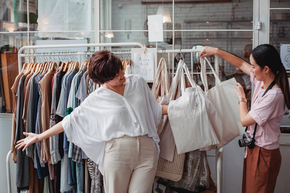 Two women shopping sustainably, enjoying fashion and friendship outdoors.