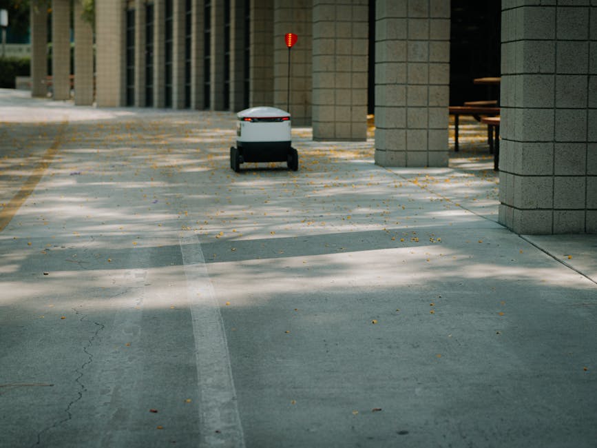 Futuristic autonomous robot on a delivery mission in a modern urban environment.