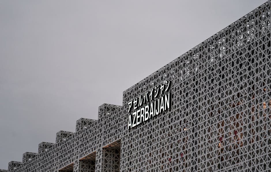 Contemporary geometric facade with 'Azerbaijan' text in Osaka, Japan, capturing modern architectural design.