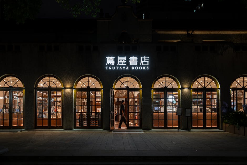 Evening view of the elegant Tsutaya Books storefront with warm lighting and inviting atmosphere.