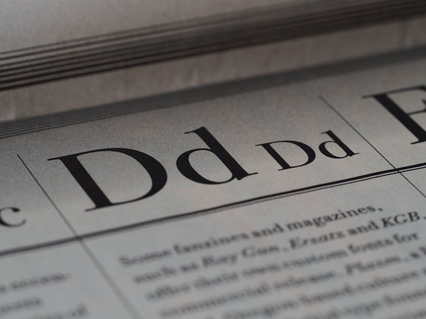 Detailed close-up of a newspaper showing typography and lettering design.