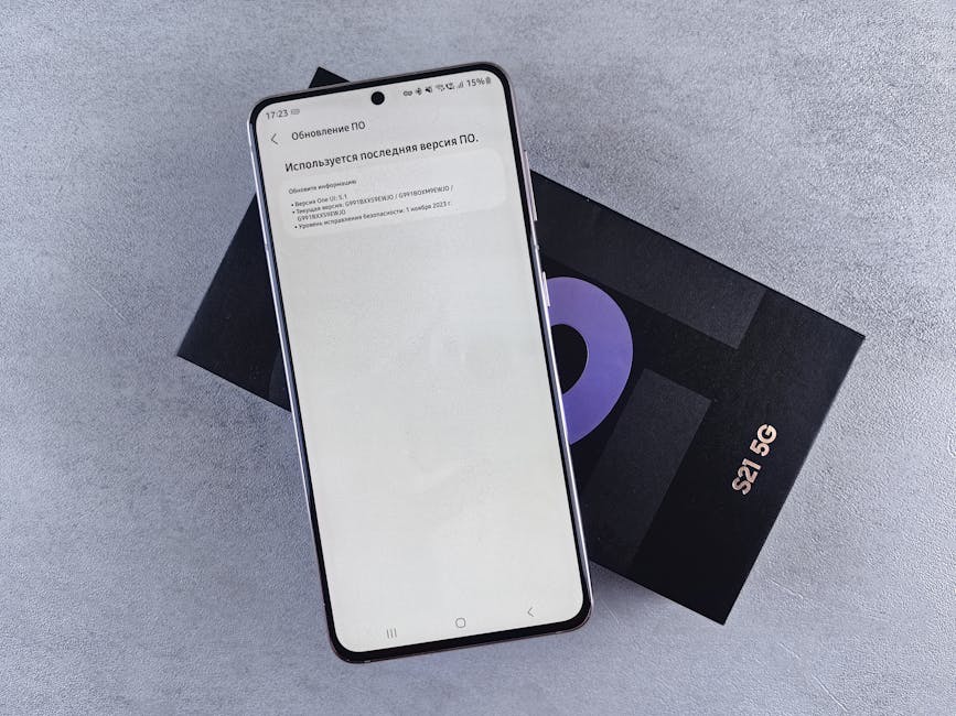 A smartphone on a box showing a software update screen, creating a tech-focused scene.
