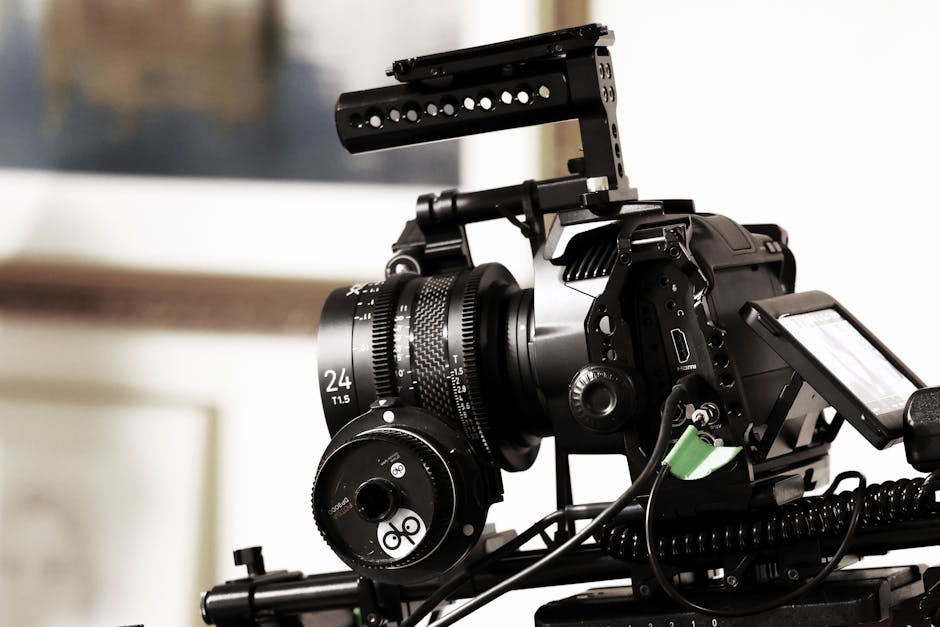 Close-up of a professional video camera rig in a studio setting, capturing cinematic scenes.